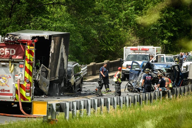 Emergency personnel at the scene of a three vehicle accident on NC 401 near Hensdale Drive north of Raeford on Friday, April 26, 2019. [Andrew Craft/The Fayetteville Observer]