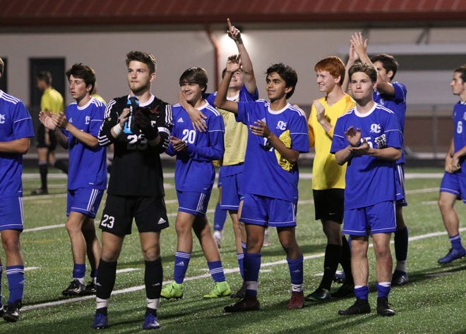 Oconee County's soccer team salutes the crowd after a 5-1 win against Sandy Creek in the Class 4A state tournament on Friday. (Photo by Matthew Caldwell/mcaldwell@onlineathens.com)
