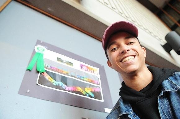 Lisandro Velazquez's art work received a ribbon during the Brockton High School art show on Tuesday, March 19, 2019. The winner will have their painting on the side of the Charity Guild as the organization's mural. 

 (Marc Vasconcellos/The Enterprise)