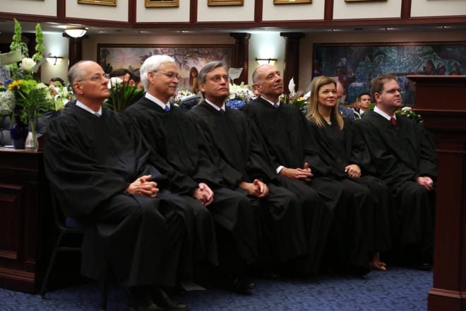 Members of the Florida Supreme Court listen to a speech by Gov. Ron DeSantis on March 5 in the Florida House during a joint session of the Florida Legislature. From left, Chief Justice Charles T. Canady, Ricky Polston, Jorge Labarga, Alan Lawson, Barbara Lagoa, and Robert J. Luck. [Scott Keeler/Tampa Bay Times/TNS]