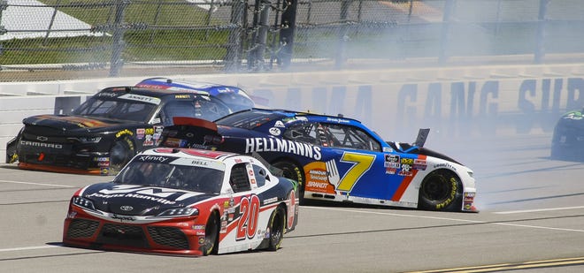 Michael Annett (1), Garrett Smithly (0) and Justin Allgaier (7) collide in the backstretch during a NASCAR Xfinity Series race at Talladega Superspeedway in Talladega, Ala., Saturday. [GREG MCWILLIAMS/THE ASSOCIATED PRESS]