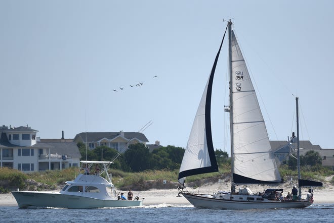 Boaters head out through Masonboro Inlet on the south end of Wrightsville Beach. STARNEWS FILE PHOTO