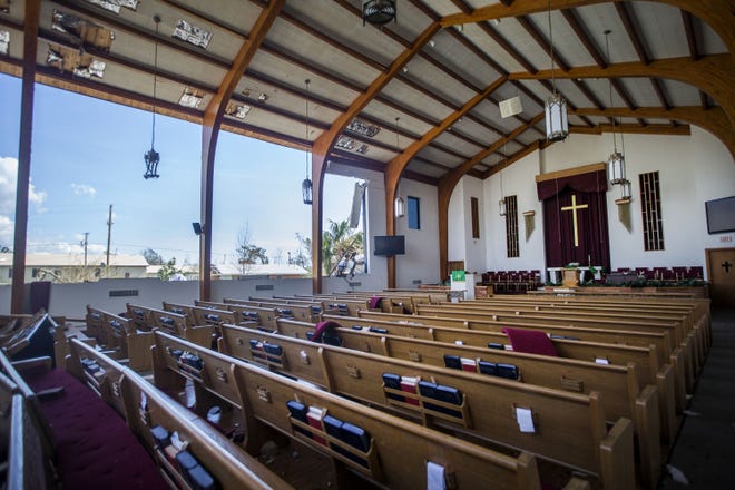 Portions of the walls and ceiling are missing at the St. Andrew United Methodist Church on the morning after Hurricane Michael in Panama City on Oct. 11, 2018. A new book by Nick May, 'Ditch the Building' posits a way forward for area churches that doesn't include rebuilding their sanctuaries. [PATTI BLAKE/NEWS HERALD FILE PHOTO]