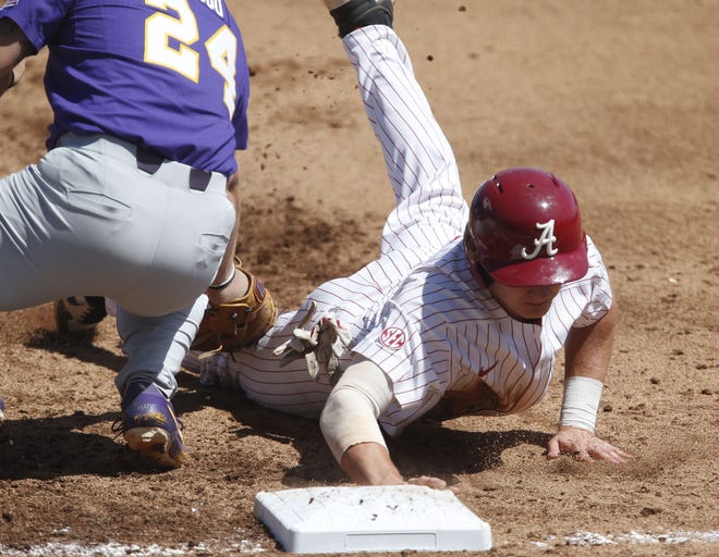 LSU first baseman Cade Beloso can't get a tag down in time to pick off Alabama base runner Drew Williamson in Saturday's game at Sewell-Thomas Stadium. LSU won 5-2. Game 3 of the series is Sunday at 1 p.m. [Staff Photo/Gary Cosby Jr.]