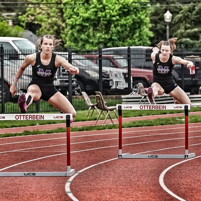 Mount Union's Michaelina Terranova, left, and Maryonna Cathey compete in the women's 400-meter hurdles and the Ohio Athletic Conference outdoor track & field championships Saturday at Otterbein University. Cathey won the event and Terranova was second.