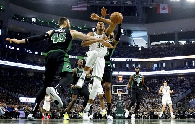 Milwaukee's Giannis Antetokounmpo scored 22 points but shot just 7 for 21, and didn't make his first field goal until the first minute of the second quarter. [Morry Gash/Associated Press]