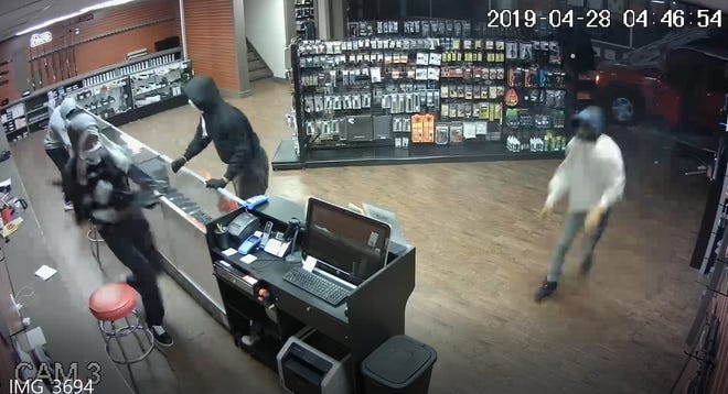 Suspects in a burglary of the Athens Gun Club early Sunday. [Photo from surveillance video provided by Athens-Clarke County police]