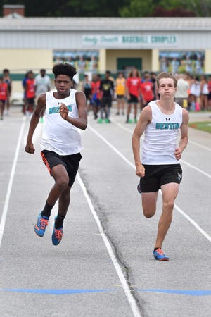 Destin Middle School's Tabious Thompson, left, and Harrison Orr compete in the Boys 100-Meter Dash during Wednesday's 1A/2A middle school meet at Etheredge Stadium. [DEVON RAVINE/DAILY NEWS]