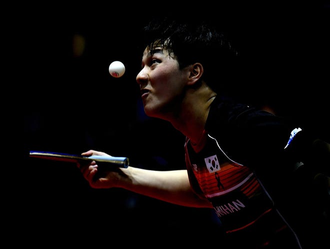 Ahn Jae-hyun of South Korea plays against Tomokazu Harimoto of Japan during their men's single round of 16 match of the World Table Tennis Championships in Budapest, Hungary, on Thursday. (Tibor Illyes/MTI via AP)
