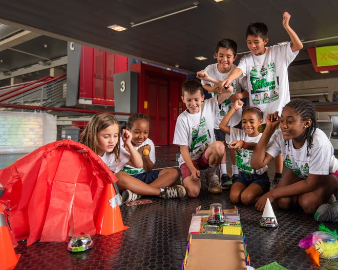 At Camp Invention, chidlren explore frequency, circuit boards, motors and gears as they use real tools to reverse engineer a remote-control robot. [Contributed Photo]