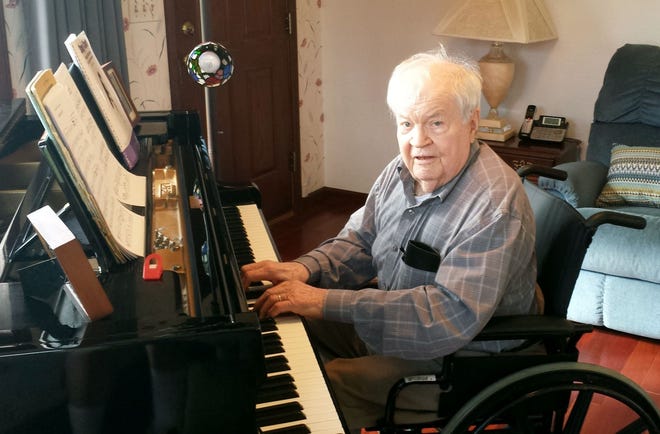 George W. Ecklund was photographed the last time he played the piano. [Photo courtesy George Ecklund Jr.]