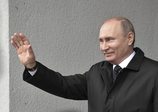 Russian President Vladimir Putin waves to and North Korea's leader Kim Jong Un as he leaves after the talks in Vladivostok, Russia, Thursday, April 25, 2019. Russian President Vladimir Putin and North Korean leader Kim Jong Un said Thursday they had good talks about their joint efforts to resolve a standoff over Pyongyang's nuclear program, amid stalled negotiations with the United States.(Alexei Nikolsky, Sputnik, Kremlin Pool Photo via AP)