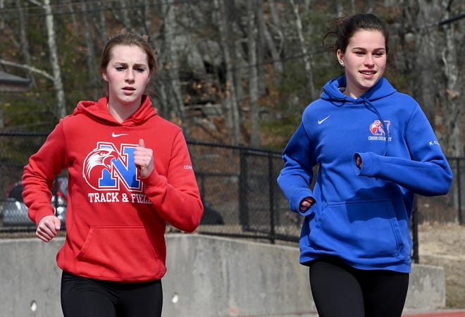 Natick senior Grace Connolly (left) and her sophomore sister Kate helped Natick girls outdoor track claim its first MSTCA Division 1 relays title in school history on Sunday. [Daily News and Wicked Local File Photo/Ken McGagh]