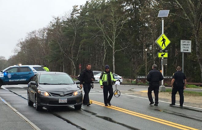 Investigators work at a scene where a pedestrian was struck by a car on Route 132 in West Barnstable Tuesday morning.