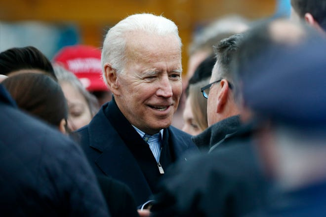 Former vice president Joe Biden talks with officials after speaking at a rally in support of striking Stop & Shop workers in Boston, Thursday, April 18, 2019. (AP Photo/Michael Dwyer)