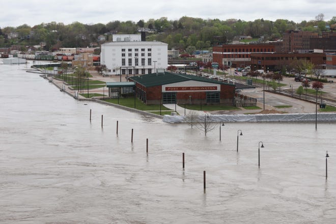 Floodwaters surround the Burlington riverfront Tuesday, held back by a combination of a concrete flood wall and sand-filled Hesco barriers. The predicted crest keeps rising, and stood at 22.9 feet Thursday, which would be the fourth-highest flood ever recorded at Burlington. [John Gaines/thehawkeye.com]