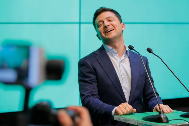 Ukrainian comedian and presidential candidate Volodymyr Zelenski speaks to his supporters at his headquarters after the second round of presidential elections in Kiev, Ukraine, Sunday, April 21, 2019.