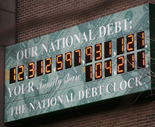 The National Debt Clock in New York is a privately funded estimate of the national debt. The number is currently in excess of $22 trillion. [ASSOCIATED PRESS]