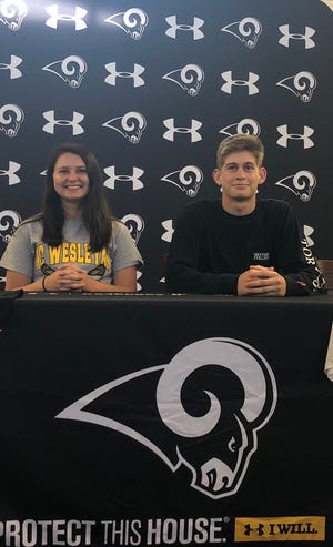 Havelock's Cassidy Atkinson and Trystan Wallace pose after signing their National Letters of Intent to play college athletics. Atkinson is a lacrosse player and is headed to North Carolina Wesleyan while Wallace plays soccer and lacrosse and is off to Brevard College. [CONTRIBUTED PHOTO]
