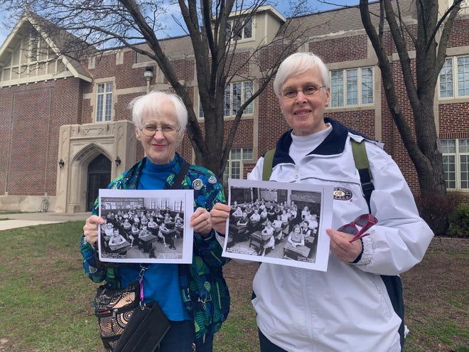 Twin sisters Georgia Deatrick, left, and Nancy Jones stand in front of the former Clay Elementary School, 635 S.W. Clay, where their fourth-grade class was integrated following the 1954 Brown v. Topeka Board of Education case. The building now houses Cair Paravel Latin School. [Phil Anderson/The Capital-Journal]