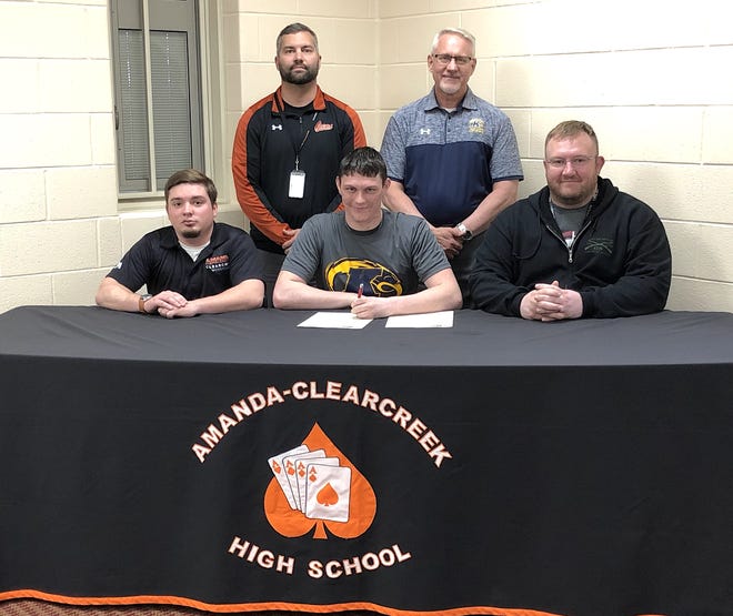 Amanda Clearcreek senior Jacob Green recently signed to wrestle at Kent State Tuscarawas. Green is seated between Aces Assistant Coach Nick Hoffman and Head Coach Robert McLaughlin. Looking on from the back row are Scott Hinton, Amanda Clearcreek Principal, and Kent State Tuscarawas Head Wrestling Coach Dave Schlarb. Submitted photo