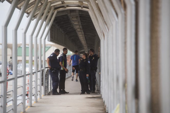 Customs and Border Protection agents check identification of pedestrians last June as they cross the McAllen-Hidalgo-Reynosa International Bridge in South Texas. [AMANDA VOISARD/AMERICAN-STATESMAN]