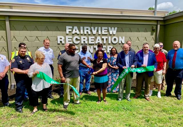 City leaders, law enforcement officials and members of the Columbia Parks & Recreation celebrate the completion of the second phase of the Fairview Recreation Center renovation project. The phase included building a new kitchen, upgrades to bathrooms and making the foyer ADA compliant. (Staff photo by Jay Powell)