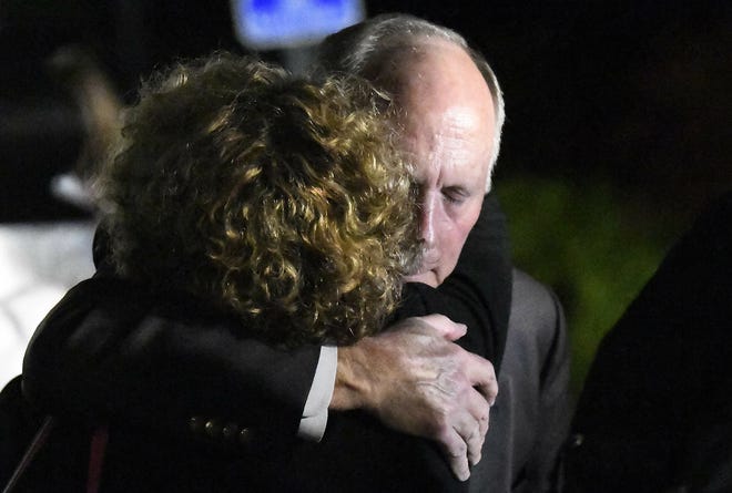 UNC Charlotte Chancellor Philip DuBois receives a hug after a news conference regarding a deadly shooting on the campus earlier in the day Tuesday in Charlotte, N.C. [DAVID T. FOSTER III/THE CHARLOTTE OBSERVER/ASSOCIATED PRESS]