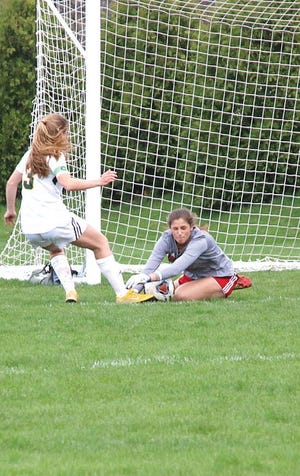 Constantine goal keeper Alyssa Parmer makes a save in the first half on Wednesday.