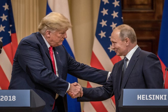 HELSINKI, FINLAND - JULY 16: U.S. President Donald Trump (L) and Russian President Vladimir Putin shake hands during a joint press conference after their summit on July 16, 2018 in Helsinki, Finland. The two leaders met one-on-one and discussed a range of issues including the 2016 U.S Election collusion. (Photo by Chris McGrath/Getty Images)