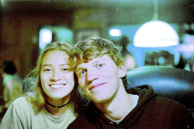 In this Sept. 1, 2017, photo provided by Matthew Westmoreland, Riley Howell, right, is seen. Authorities say Howell, 21, was killed after he tackled a gunman who opened fire in a classroom at the University of North Carolina-Charlotte. [Matthew Westmoreland via AP]