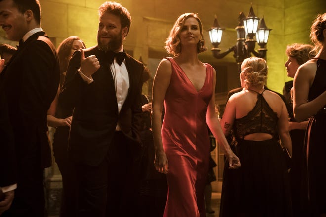 This image released by Lionsgate shows Seth Rogen, left, and Charlize Theron in a scene from "Long Shot." [Murray Close/Lionsgate via AP]