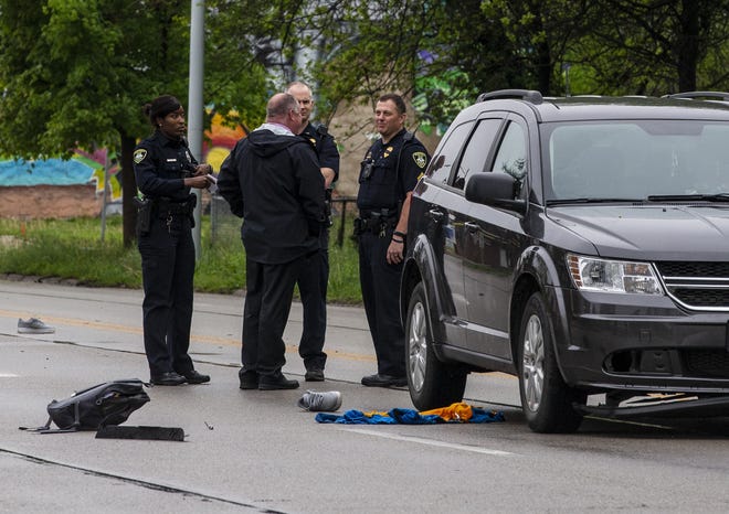 Springfield Police investigate the scene of an accident involving a vehicle versus a pedestrian at Sound Grand Avenue East and South Loveland Avenue, Thursday, May 2, 2019, in Springfield, Ill. A 15-year-old male pedestrian attempted to cross South Grand Avenue near Loveland Avenue when he was struck by the vehicle. He was transported to the hospital in critical condition. [Justin L. Fowler/The State Journal-Register]