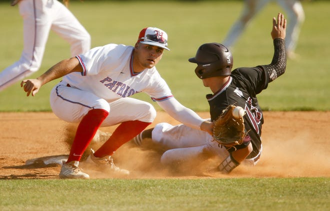 Benjamin Russell base runner Ty Brown while second baseman Kash Ryan takes the throw as Hillcrest hosted Benjamin Russell High in the State High School Baseball Playoffs Thursday, May 2, 2019. [Staff Photo/Gary Cosby Jr.]