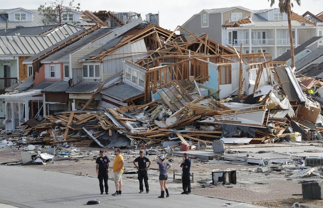 Rescue personnel perform a search in the aftermath of Hurricane Michael on Oct. 11, 2018, in Mexico Beach. [AP Photo/Gerald Herbert, File]