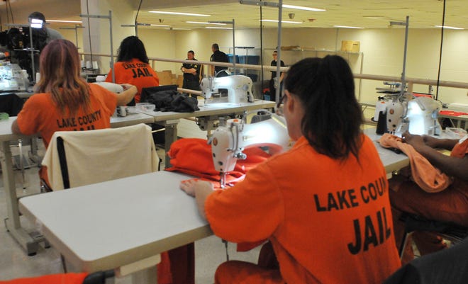 Inmates in the new Lake County Jail Sewing Textile Program work on uniforms. [TOM BENITEZ / CORRESPONDENT]