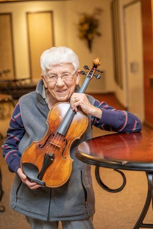 Violist Carolyn Tarzia is retiring from the Adrian Symphony Orchestra after some 27 years.