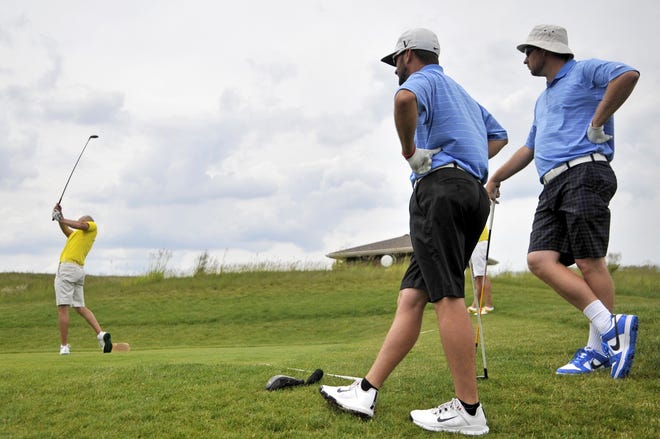 NICK SCHNELLE/JOURNAL STAR FILE PHOTO

Dustin Ziegler of Taz-Wood tees off from the fifth hole as Peoria County team members Travis Kreiter and Scott Phegley watch on the final day of the 2017 River Cup golf match between Peoria County and Taz-Wood.