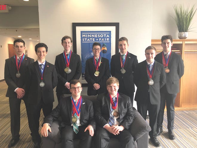 Xavier Lora of Middletown, standing second from left, with his Bishop Hendricken High School Academic Decathlon teammates at this year's nationals. [CONTRIBUTED PHOTO]