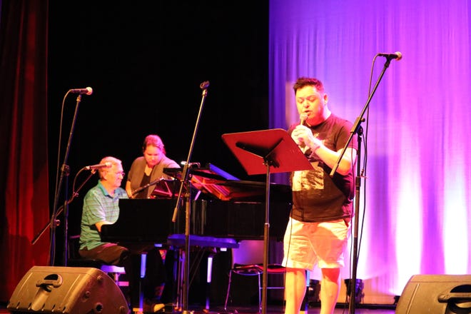 Sean Whitworth (right) on stage at the Don Gibson Theatre in 2018 with Leslie Brown and Jimmy Brown. Whitworth, a local actor who died last year, helped raise money for Wanda's Wish scholarship program. [Special to The Star]