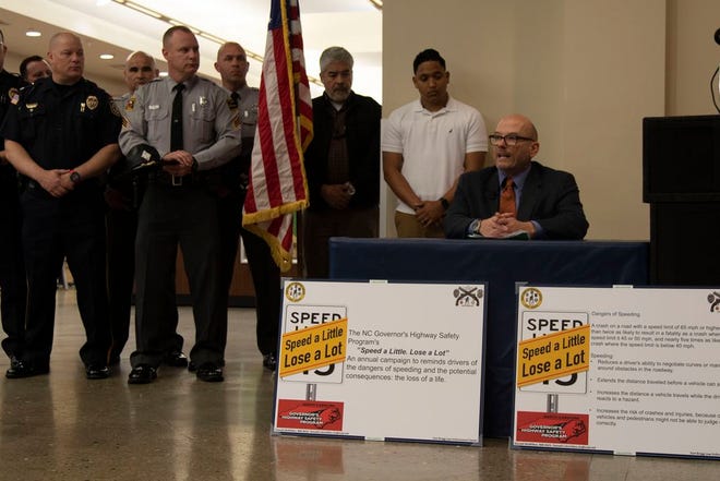 Mark Ezzell, North Carolina Governor’s Highway Safety program director, speaks at the North Post Exchange during the Speed a Little, Lose a Lot campaign kick-off.