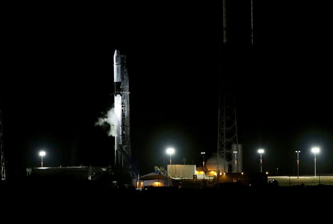 A SpaceX Falcon 9 remains on space launch complex 40 after a scrubed launch attempt to deliver supplies to the International Space Station at the Cape Canaveral Air Force Station on Friday in Cape Canaveral. [AP Photo/Terry Renna]