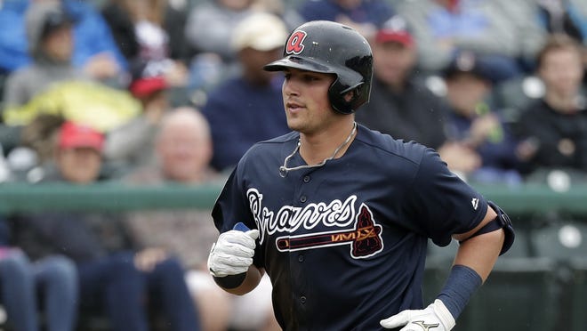 Atlanta Braves' Austin Riley rounds third base after hitting a home run against the Washington Nationals in a spring training game this past spring. (AP Photo/John Raoux)