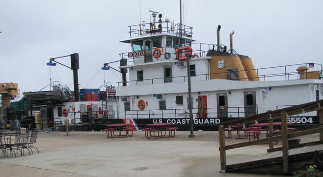 Coast Guard Cutter Sciota is seen Thursday the Keokuk Yacht Club after it decamped from its usual moorings on Mississippi Drive due to flooding. [Chris Mills for The Hawk Eye]