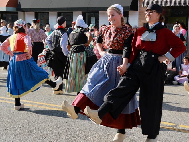 Onalee Ritsema, right, and her partner Franchesca James, perform as part of the Dutch Dance on Monday, April 22, in downtown Zeeland. [Brian Vernellis/Sentinel Staff]
