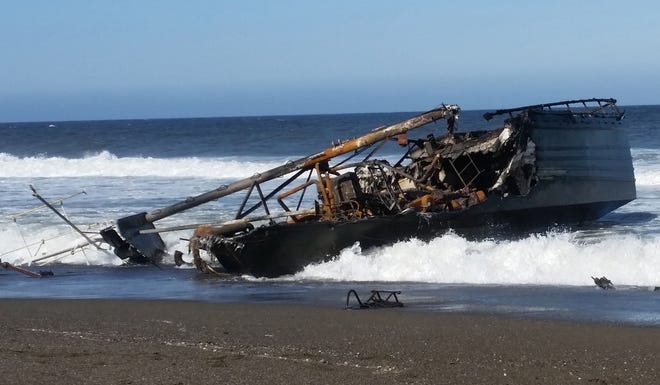 The remains of the fishing vessel Ann Kathleen on a beach north of Floras Lake on Friday, May 3, 2019. [Oregon Parks and Recreation Department]