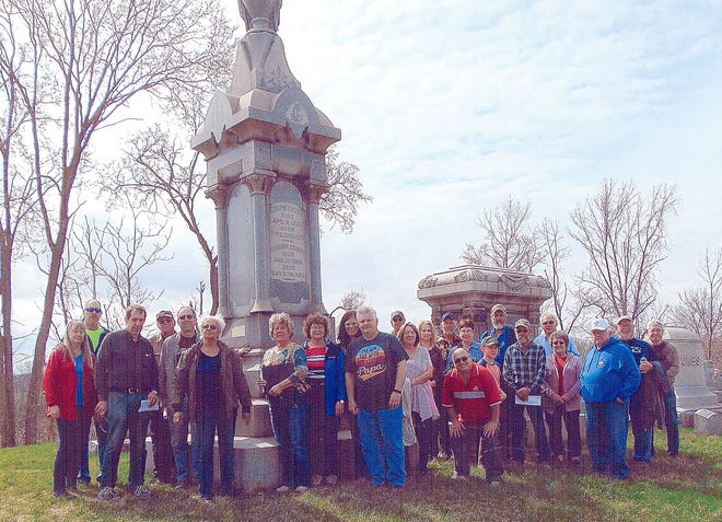 Pictured are some of the people who attended the Cumberland cemetery tour standing in front of the gravestone of Joseph Covert who died in 1891.