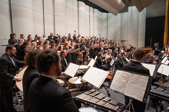 The Adrian Symphony Orchestra, the Adrian College Choir, the Chiaroscuro Men’s Chorus, and the Carillon Women’s Chorale and soloists baritone Jonathan Lasch, soprano Allison Prost and tenor Nicholas Music perform "Carmina Burana" Friday at Dawson Auditorium.