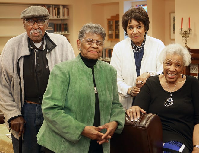 From left, Lester Lewis, Betty Coleman Moore, Judy Jackson and Irma Scroggins share fond memories of their time at the largely forgotten Pierce Addition elementary school they attended in the 1930s and 1940s. [Thad Allton/The Capital-Journal]