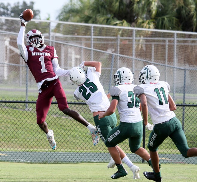 Riverview's Malachi Wideman makes a one-handed catch for a touchdown behind three Lakewood Ranch defenders in a scrimmage last summer at Venice High's Powell-Davis Stadium. [HERALD-TRIBUNE STAFF PHOTO / DENNIS MAFFEZZOLI]